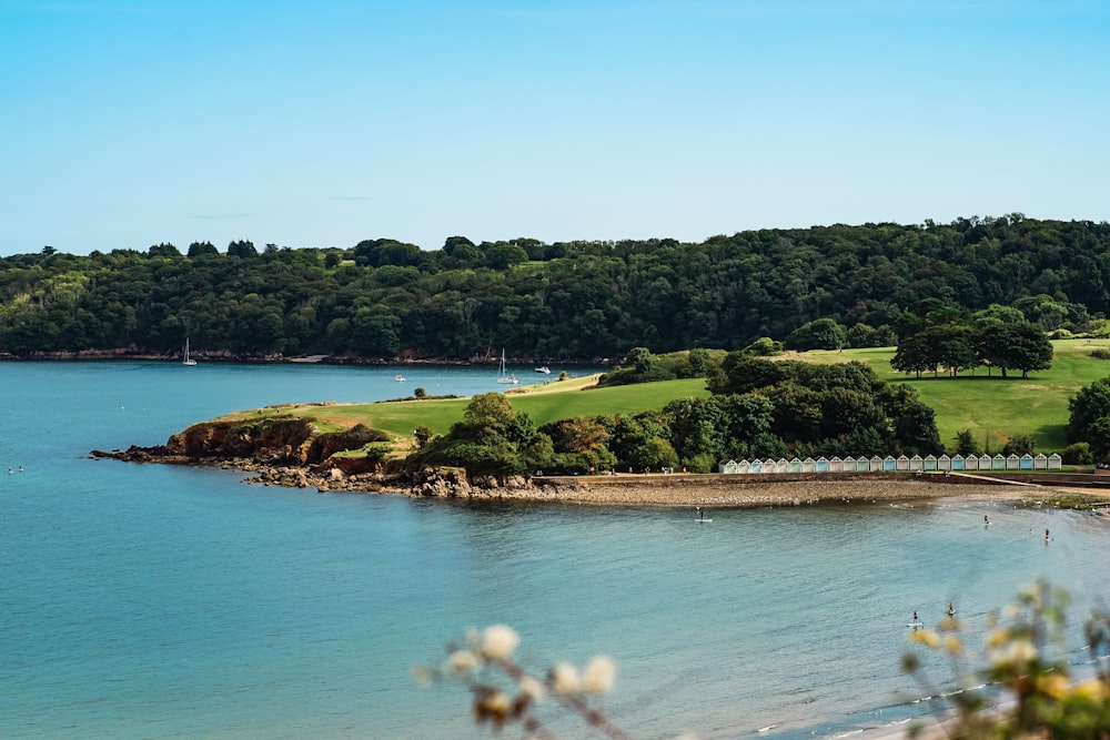 a body of water with land in the back