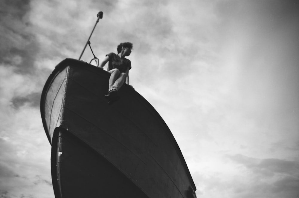 a man sitting on a large black and white object