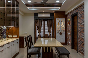 a dining room with a brick wall
