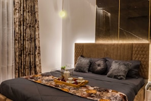 a couch with pillows and a table