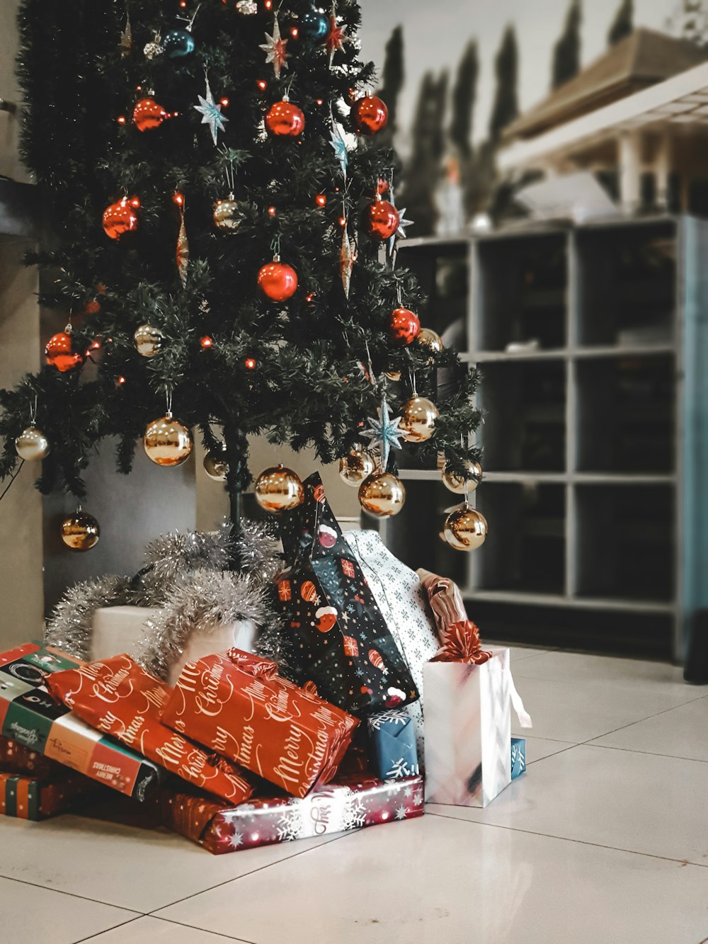 a christmas tree with presents underneath