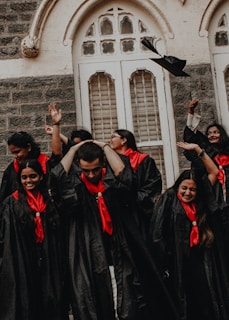 a group of people in black robes