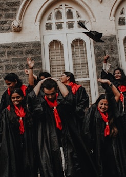 a group of people in black robes