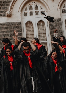 a group of people in black robes