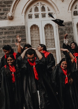 a group of people in black robes