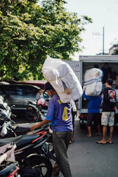 a person carrying a large bag