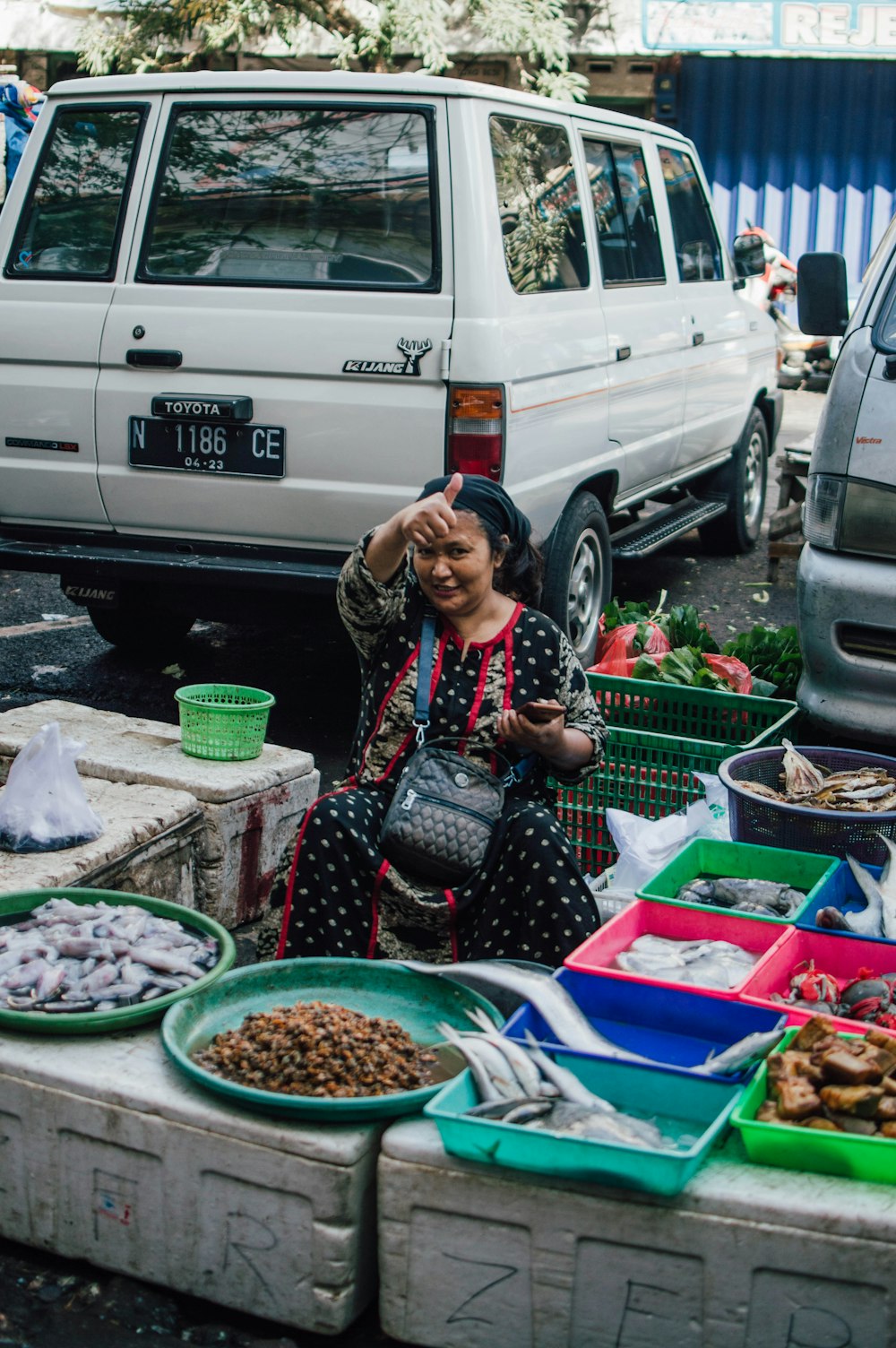a person selling vegetables