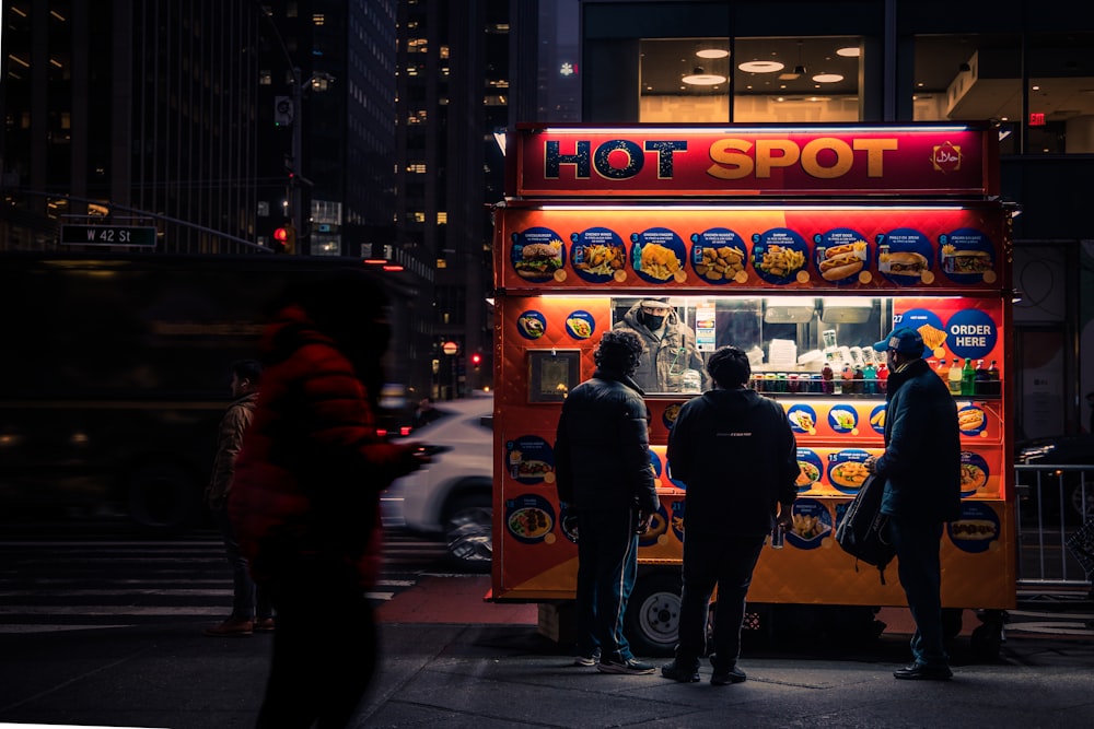 people standing in front of a food truck