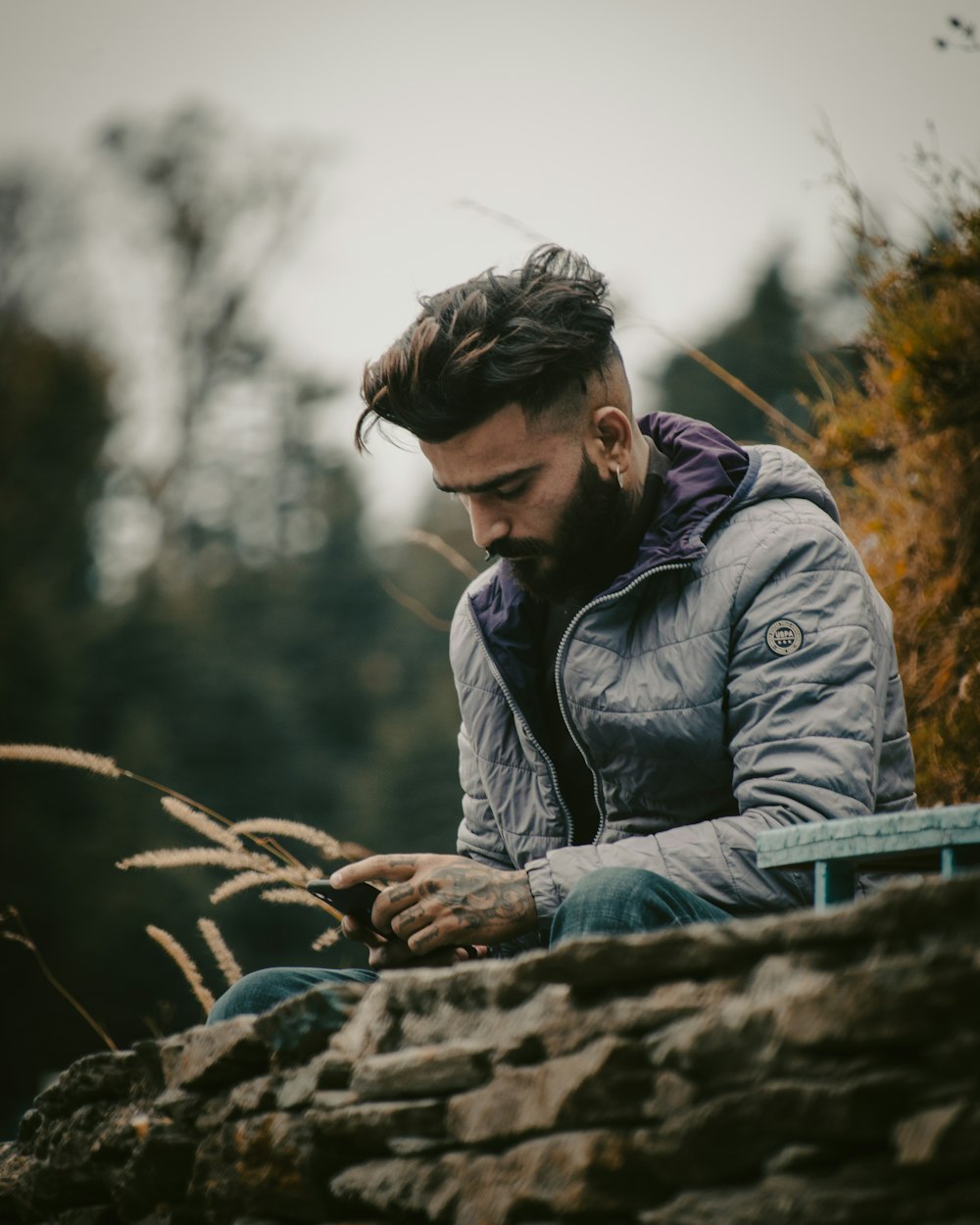 a person sitting on a rock