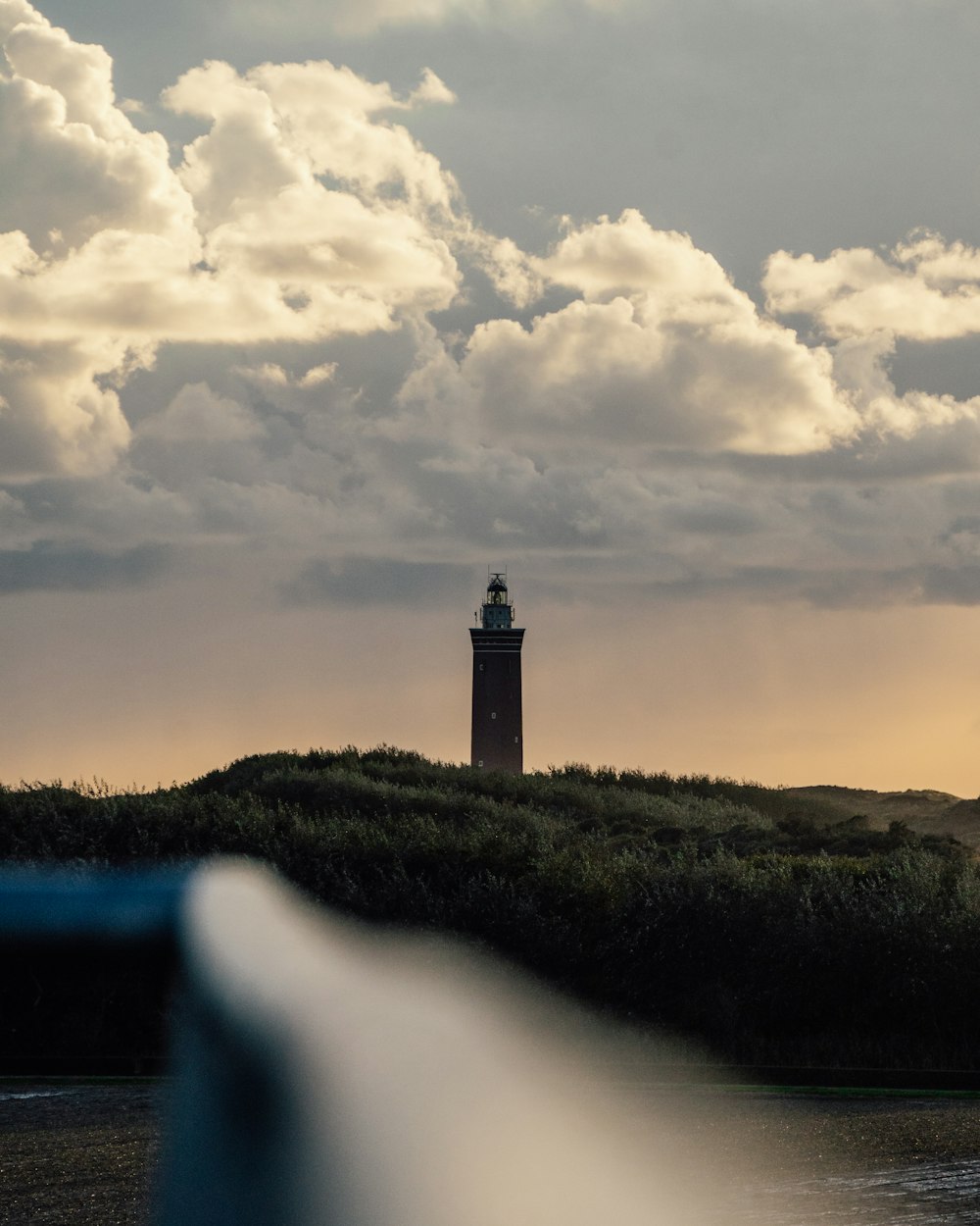 a lighthouse on a hill