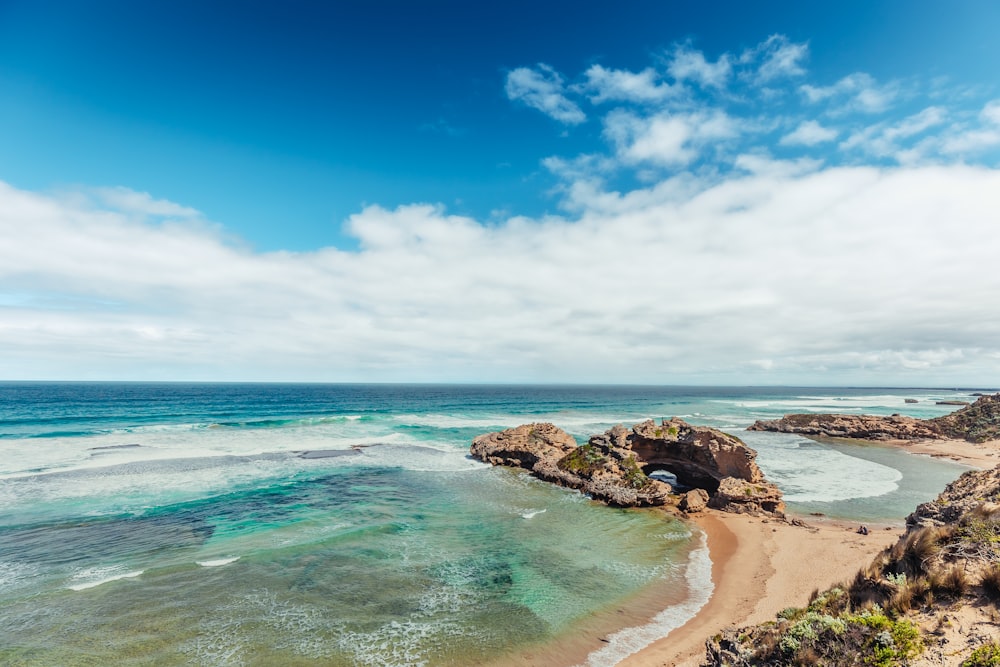 a beach with blue water