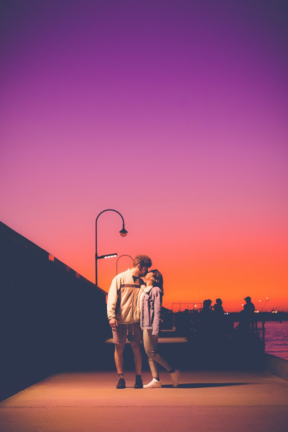 a man and woman kissing