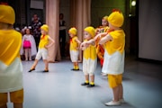 a group of children in yellow shirts