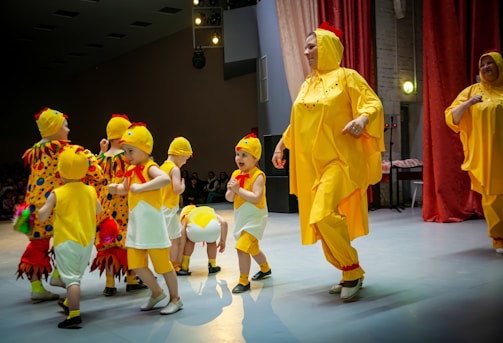 a person in a garment surrounded by children
