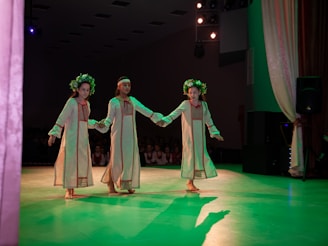 a group of women dancing on a stage