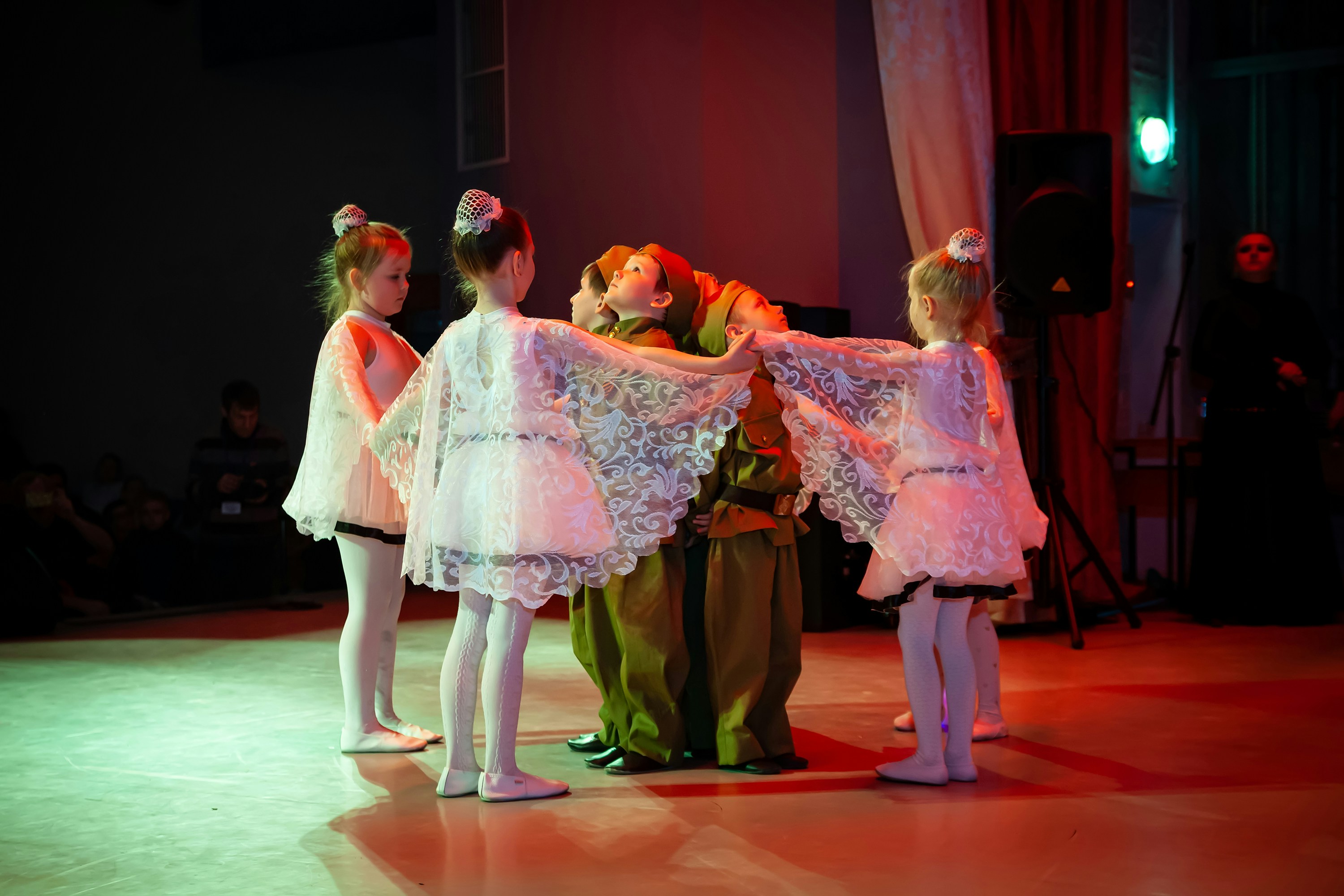 Group of children performing on stage