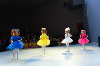 a group of children performing on a stage