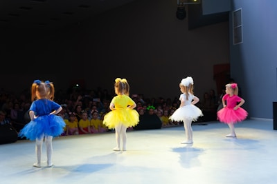 a group of children performing on a stage