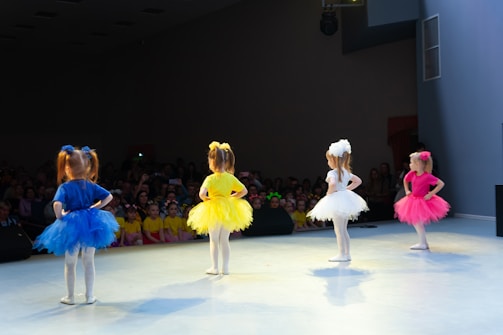 a group of children performing on a stage