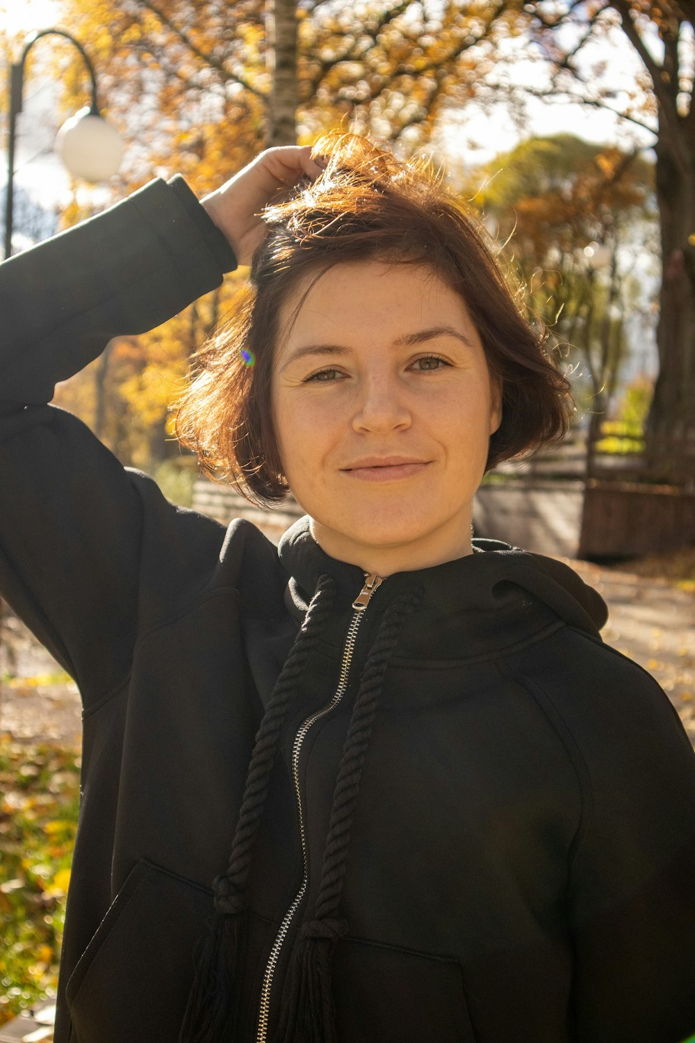 a woman with her hand on her head