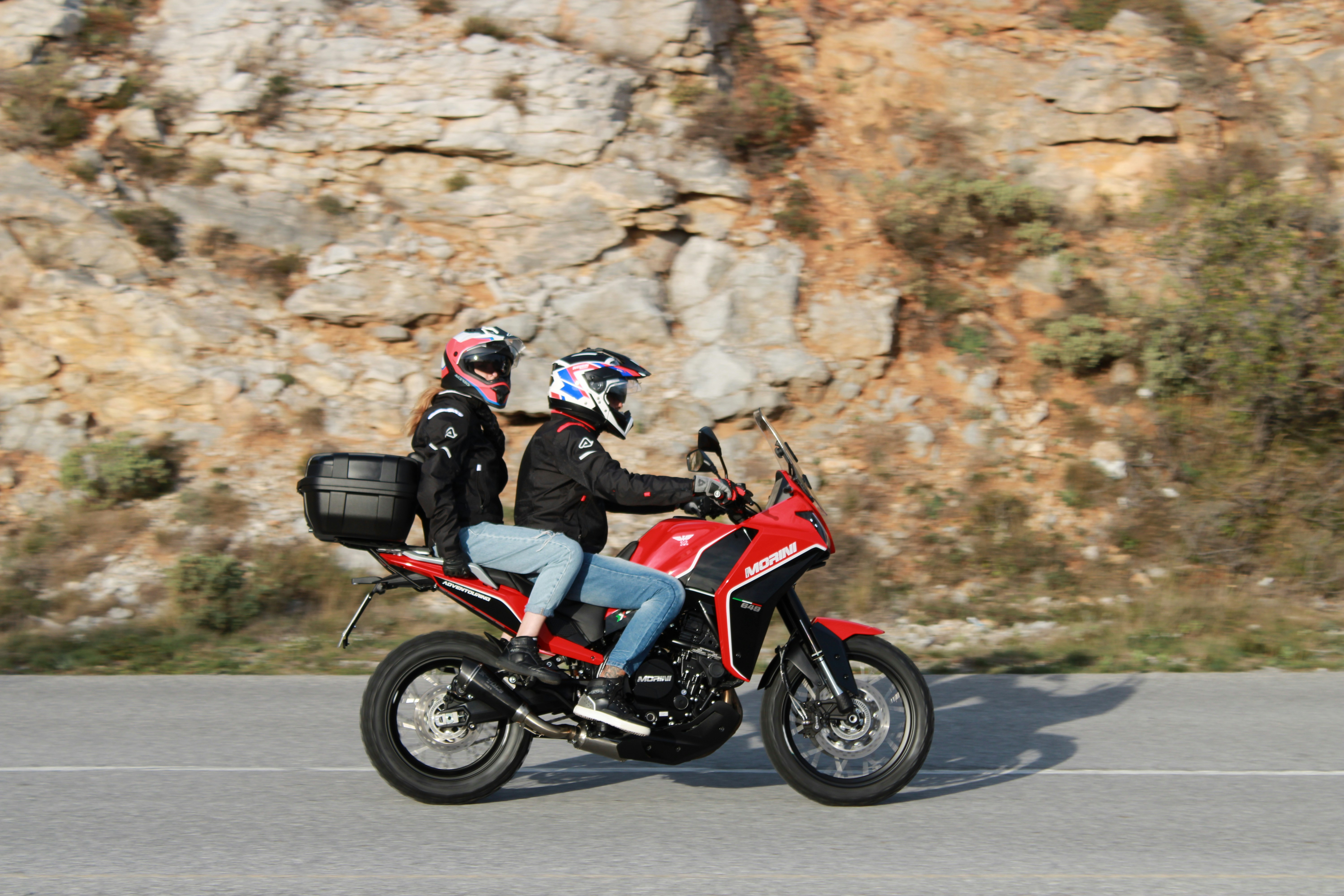 A couple of people ride a motorcycle photo Free Province of savona Image on Unsplash