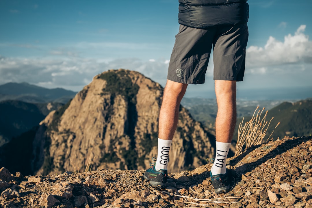 a man standing on a mountain,