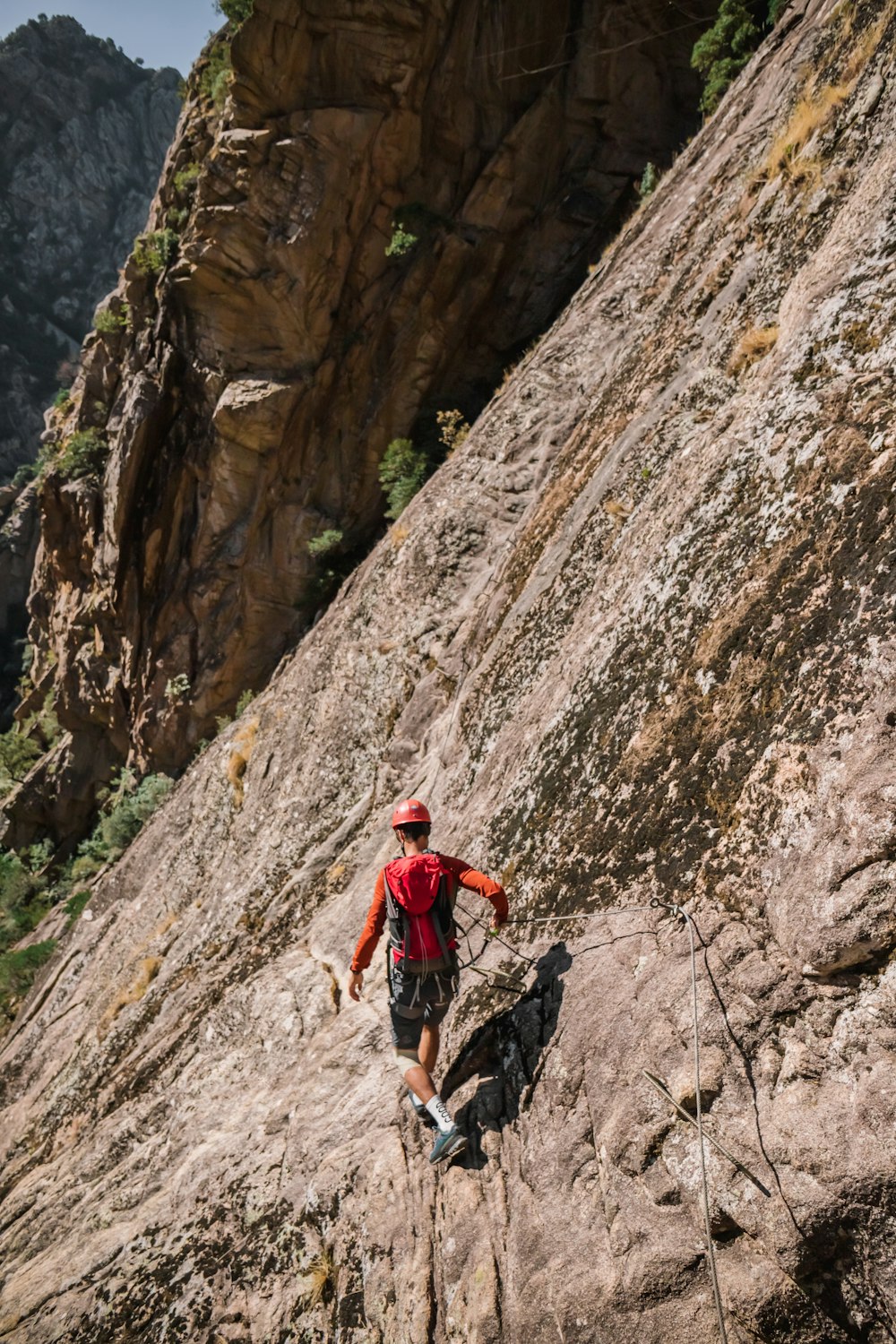 a man climbing a rock