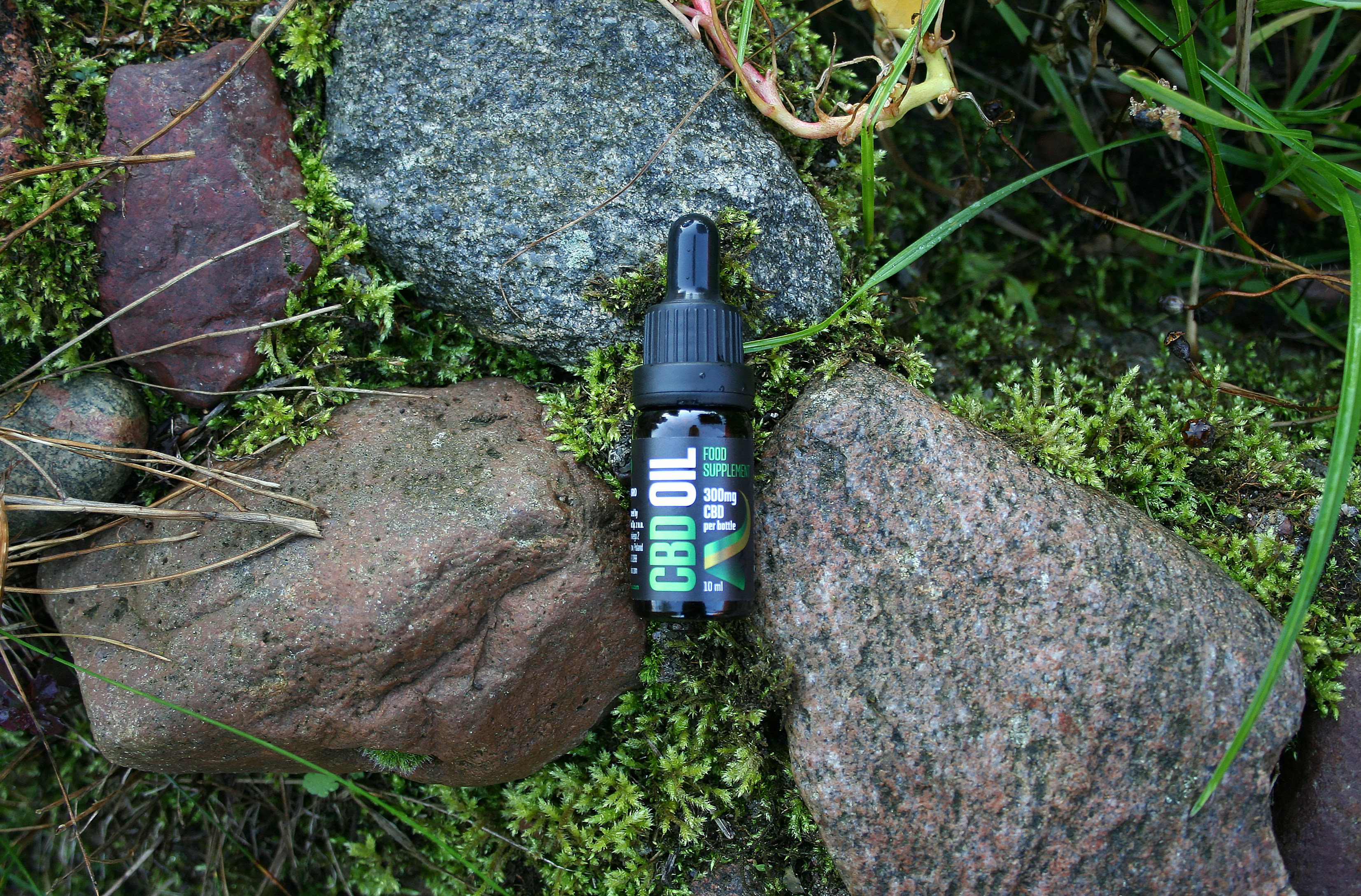 a bottle of liquor on a rock