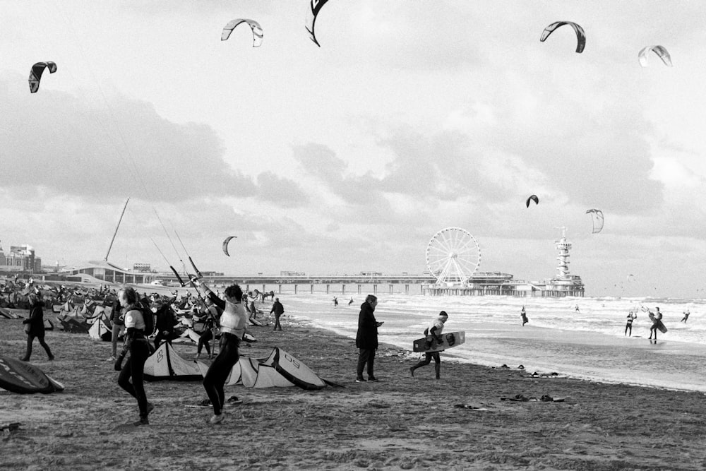 people with kites on beach