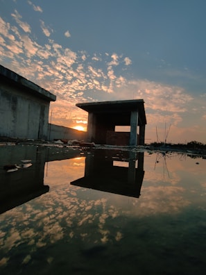 A vibrant sunset over a partially built structure.