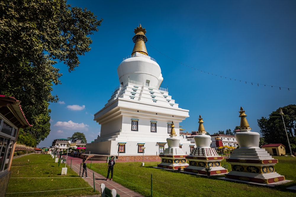 a white building with gold domes