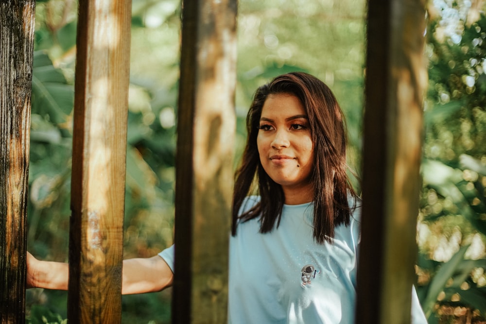 a person standing between trees