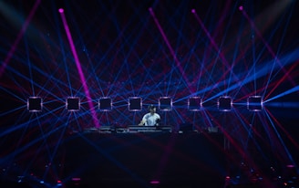 a person on a stage with lights