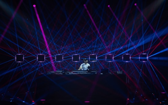 a person on a stage with lights