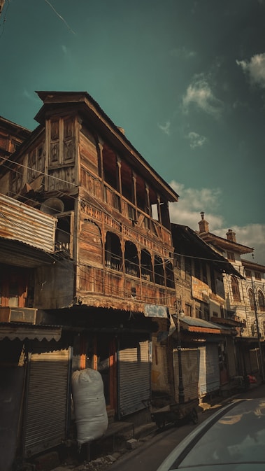 a building with a street and cars