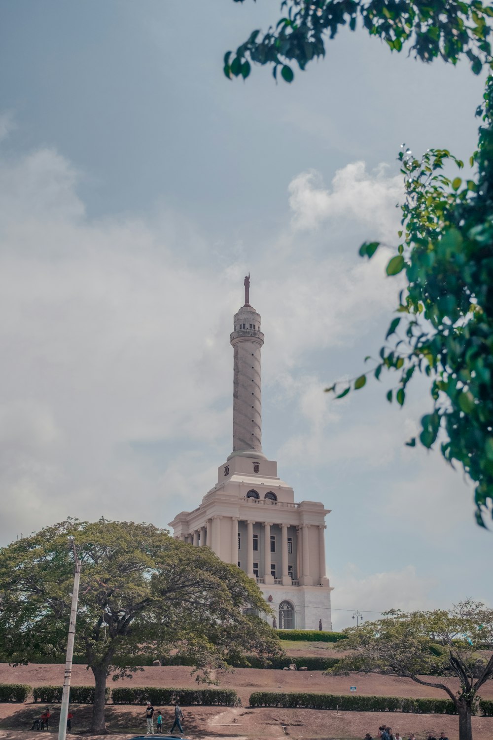 a tall white building with a tower