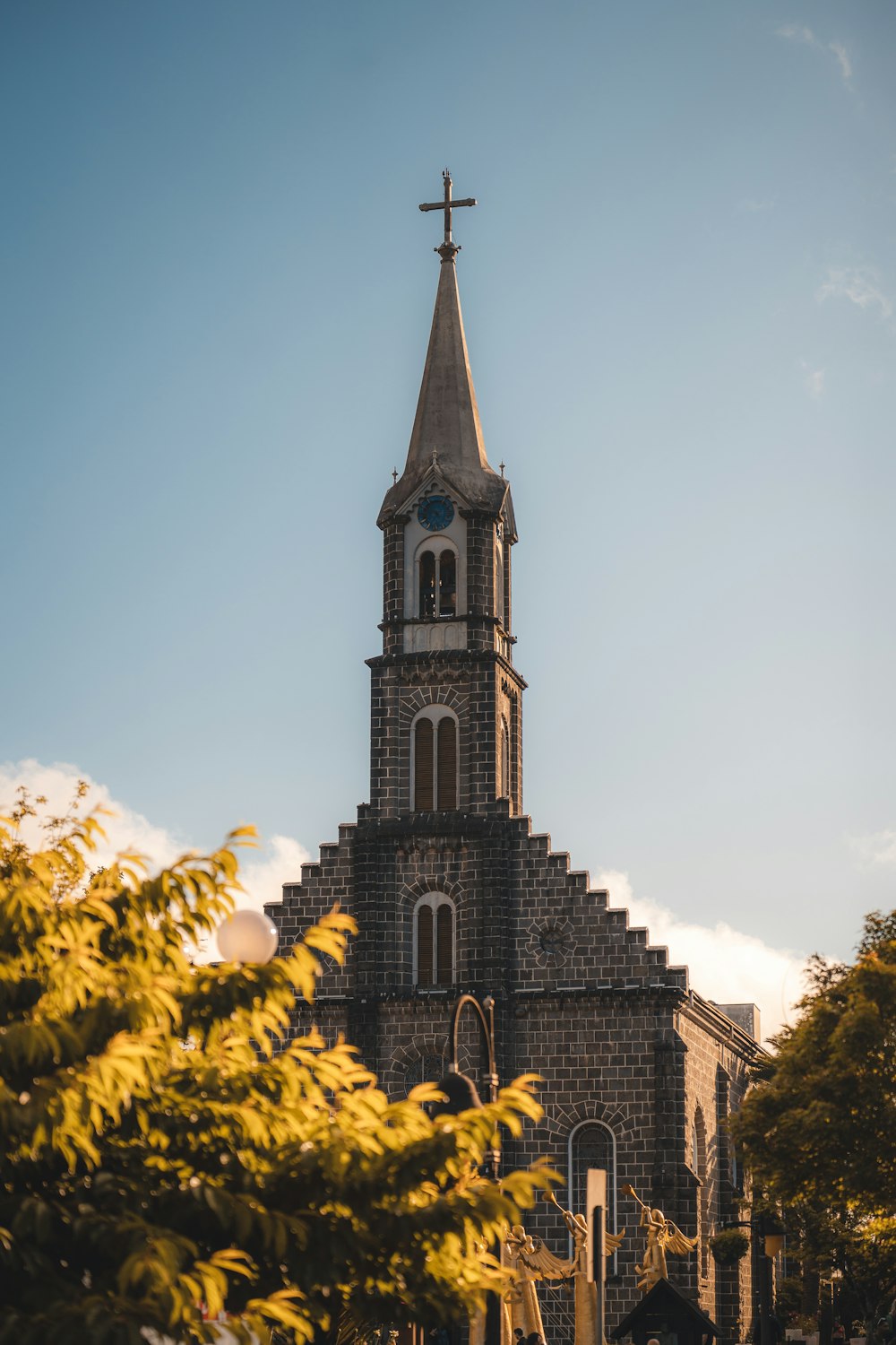 a tall building with a cross on top