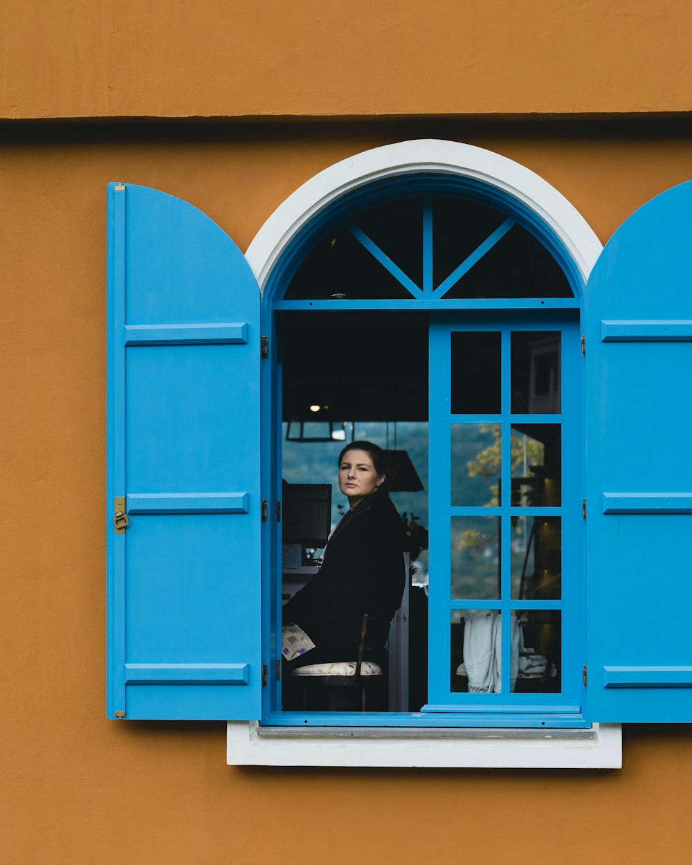 a person sitting in a window