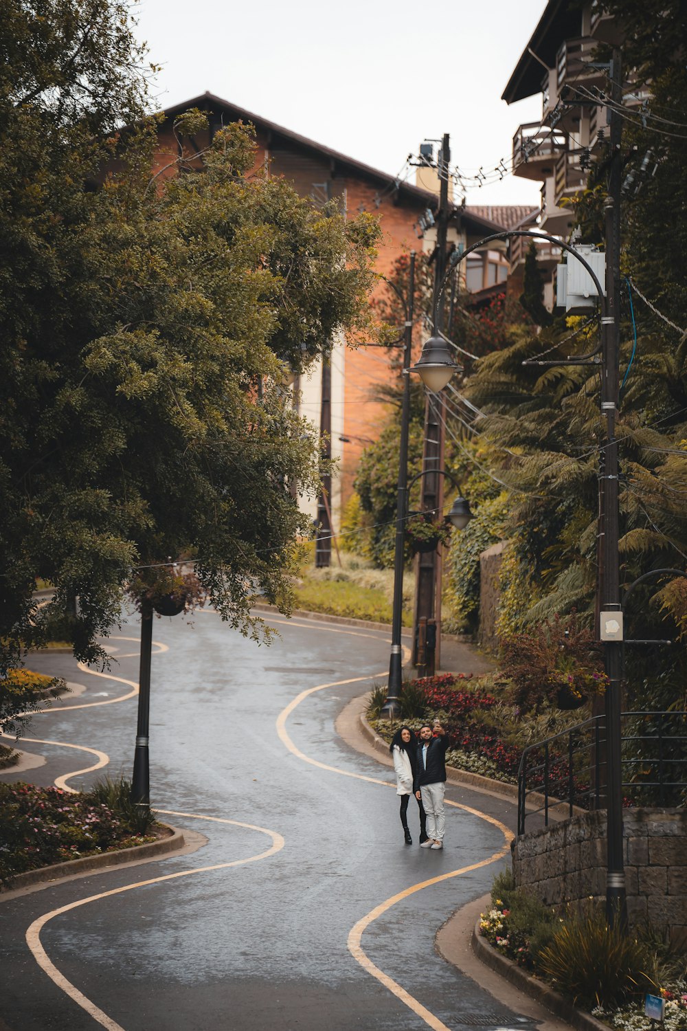 a couple walking down a street