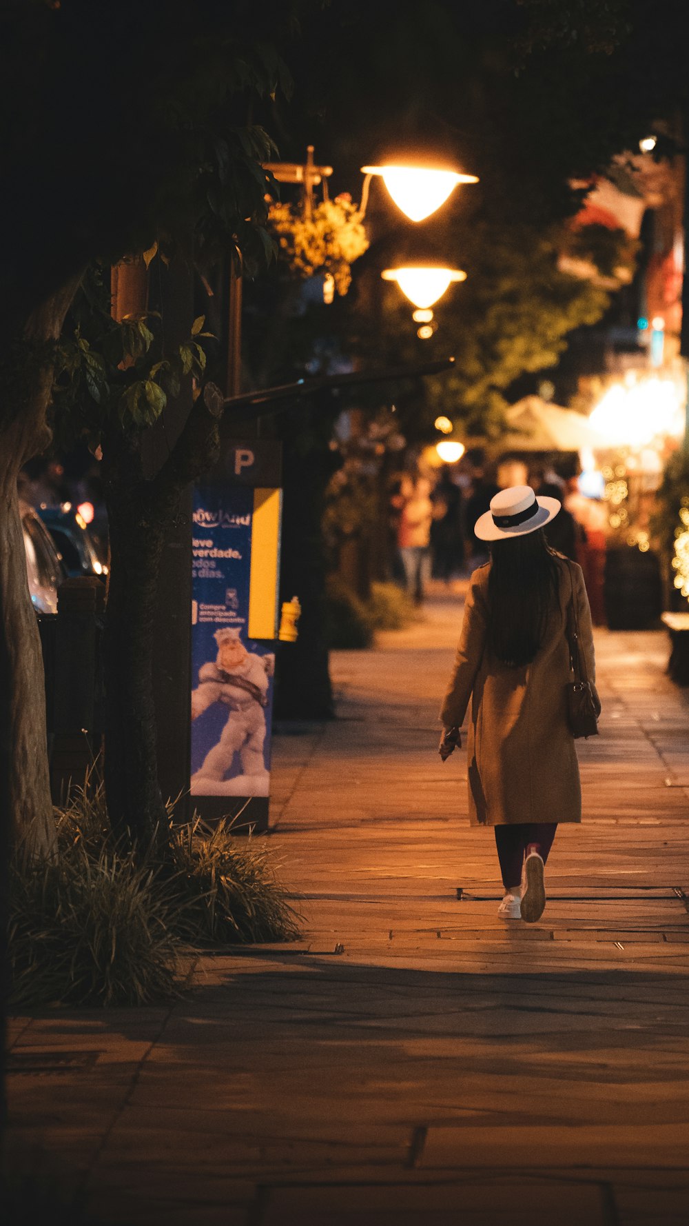 a person walking down a sidewalk