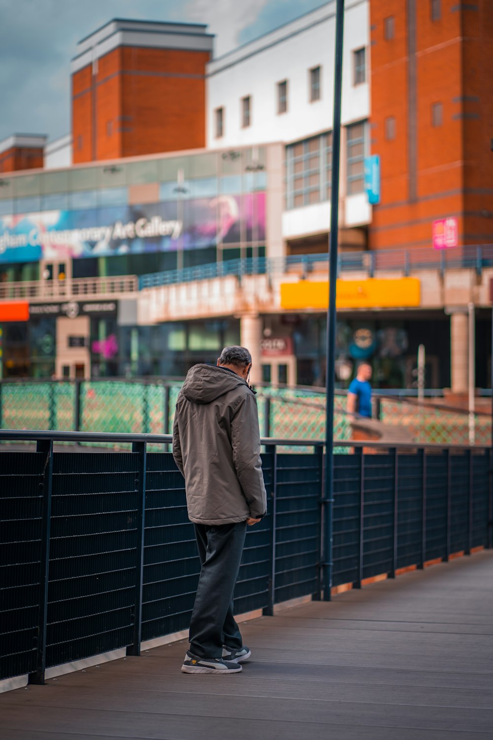 a man standing on a sidewalk