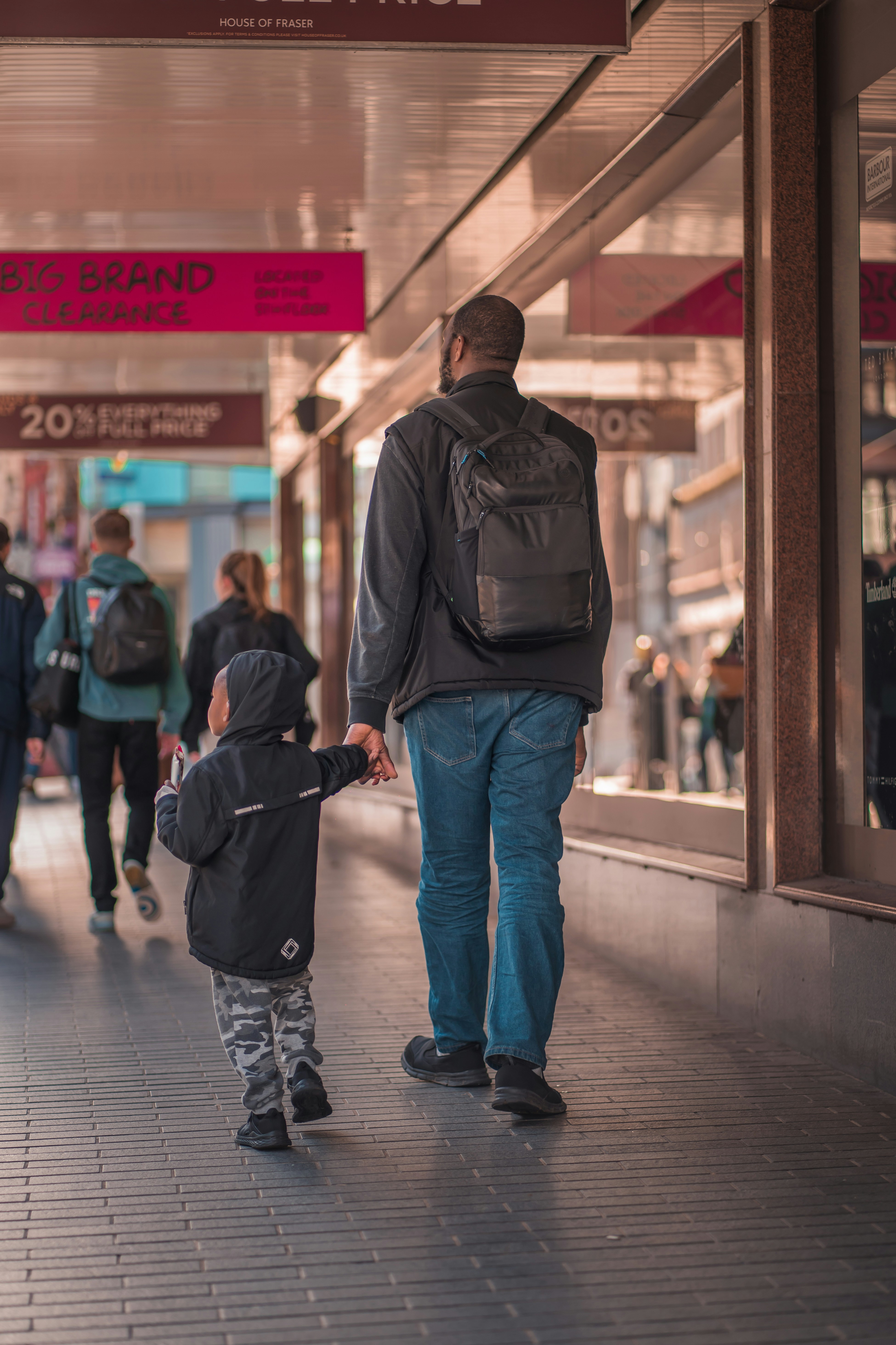 a person and a child walking