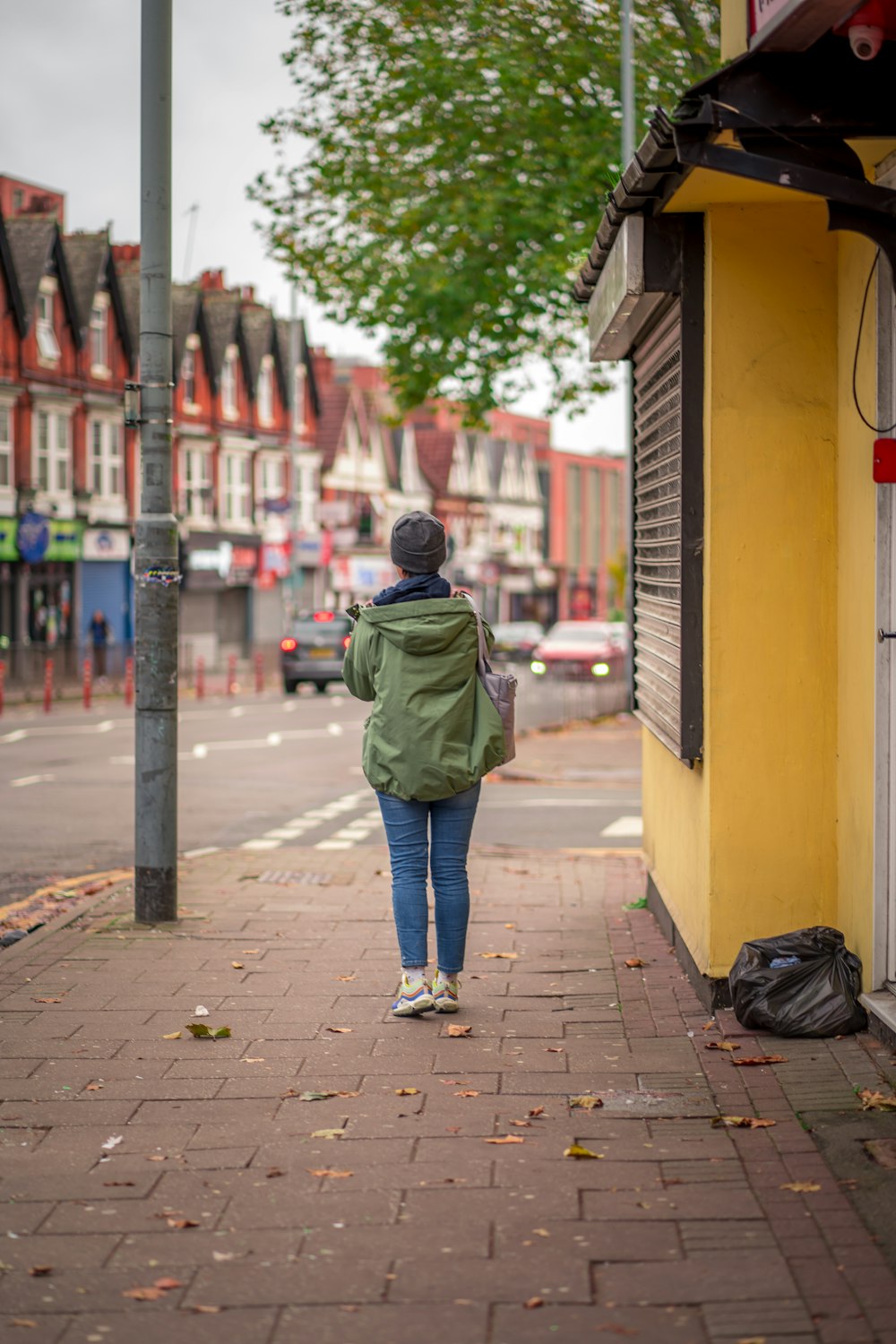 a person walking on a sidewalk