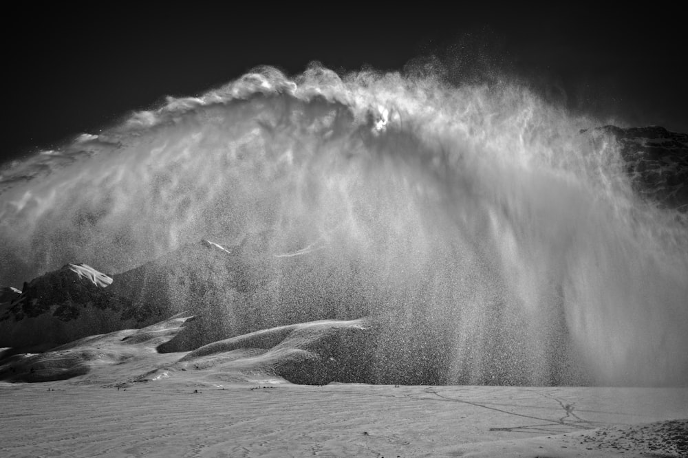 a large wave crashing into a beach