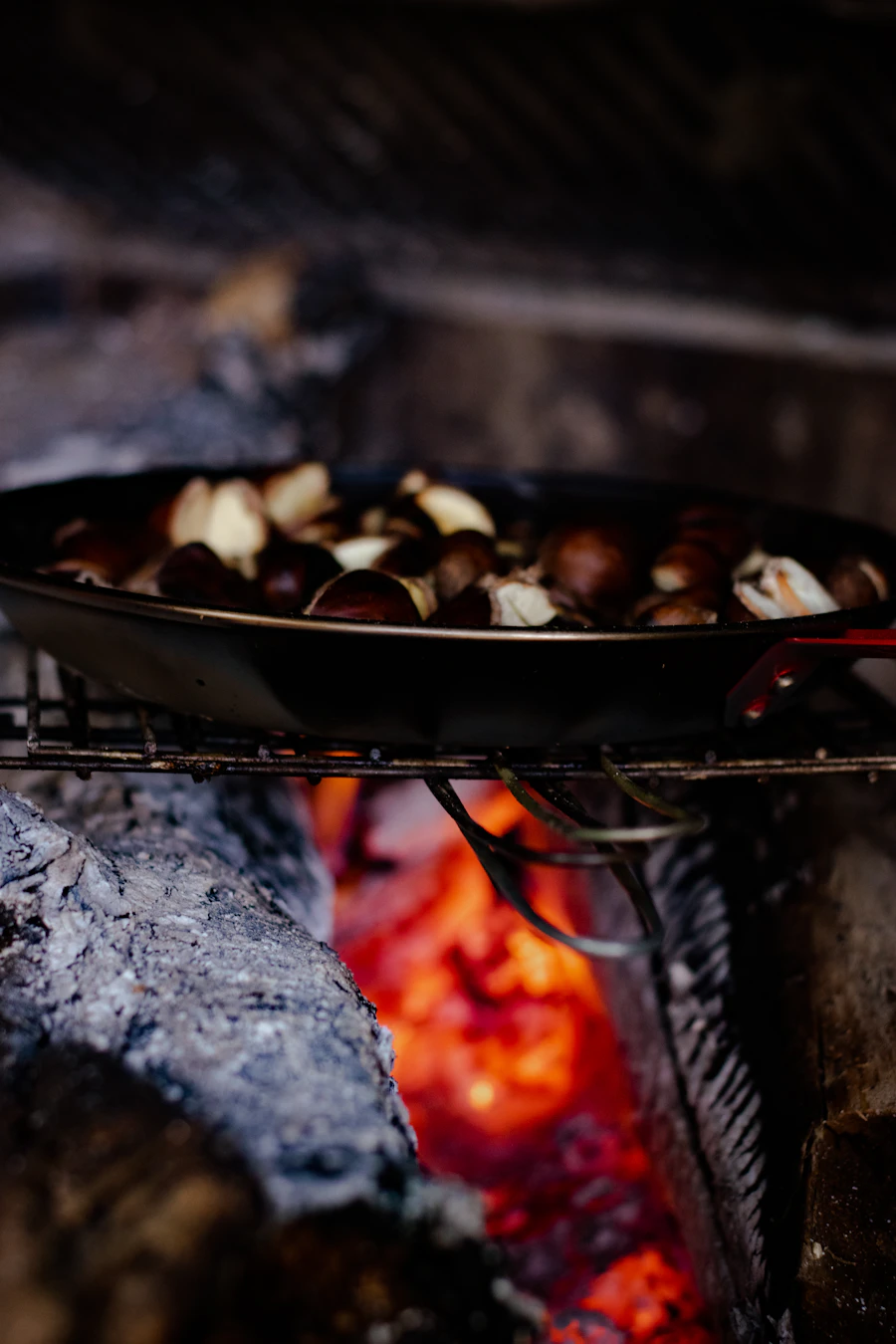 A long-handled chestnut roasting pan for an open fire