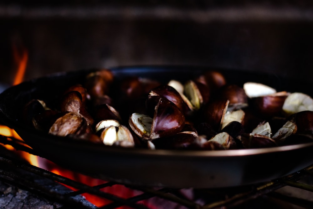 a grill with food cooking on it