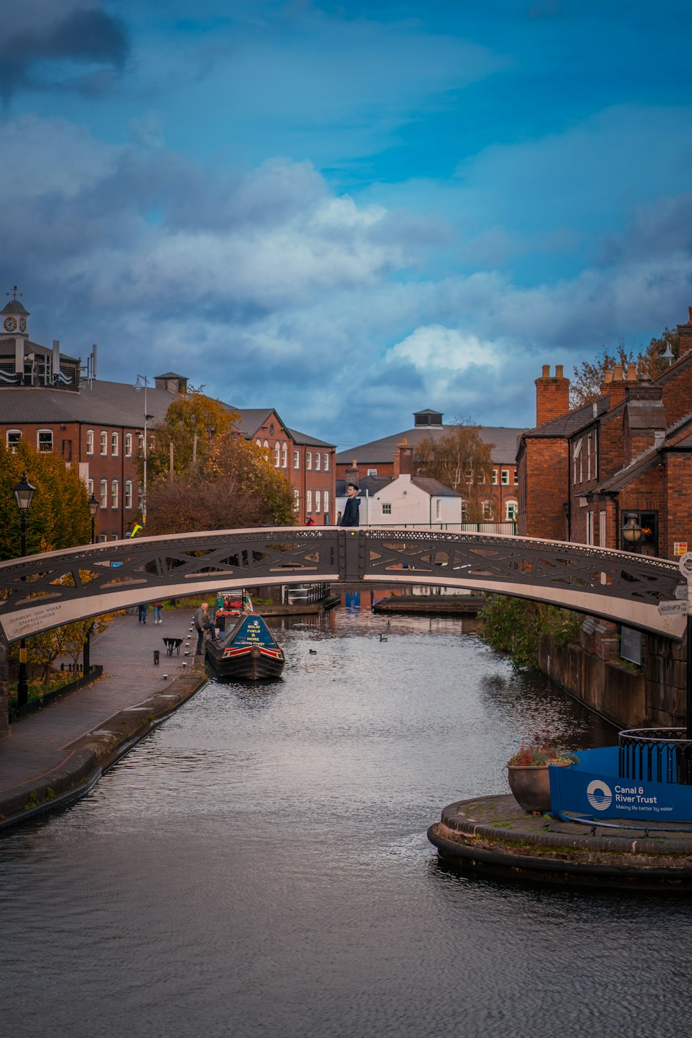 a bridge over a river with boats