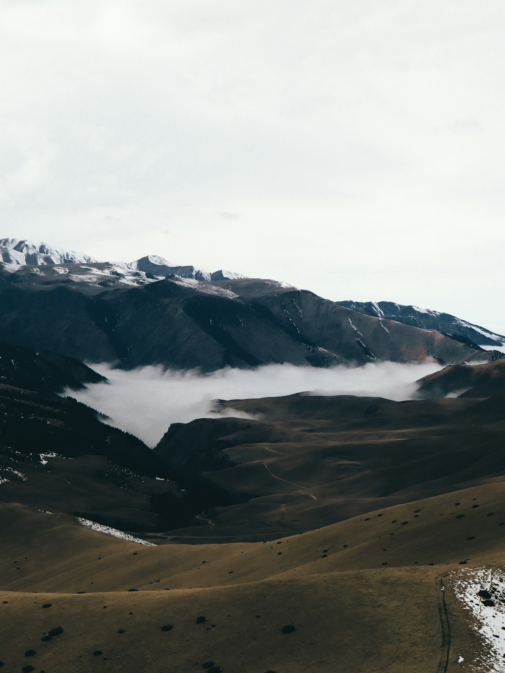 a mountain with clouds