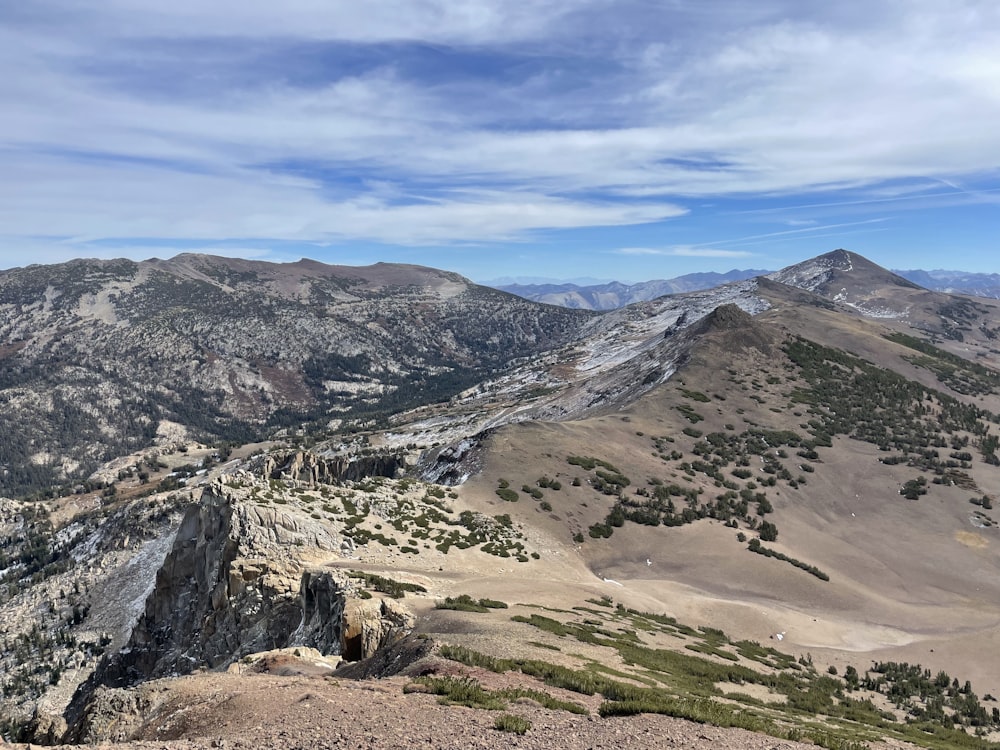 a valley with mountains in the background