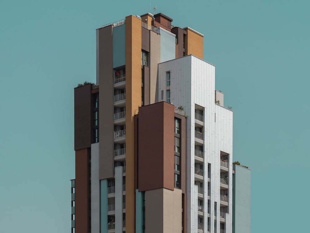 a tall building with a blue sky